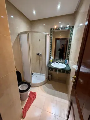 a bathroom with a shower and a toilet and a sink at Kech in Marrakech