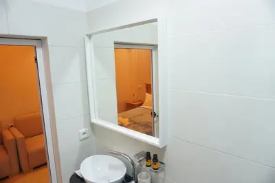 a bathroom with a sink and a mirror at Cozy studio au Centre Marrakech in Marrakech