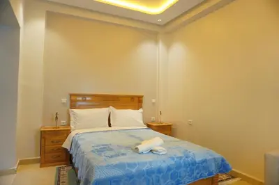 a bedroom with a bed with two towels on it at Cozy studio au Centre Marrakech in Marrakech
