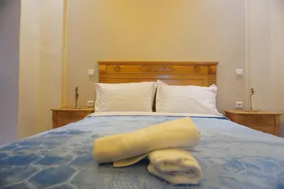 a towel is laying on a blue bed at Cozy studio au Centre Marrakech in Marrakech
