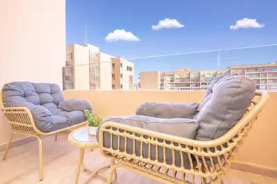two chairs and a table in a room at Luxury Apartment Hivernage 5 minutes from Jemaa El Fna in Marrakech
