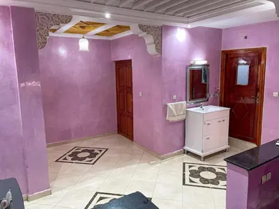 a purple bathroom with a sink and a mirror at Nice Apartment in Marrakesh in Marrakech