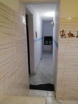 a hallway with a shower in a room at Dar Essalam in Marrakech