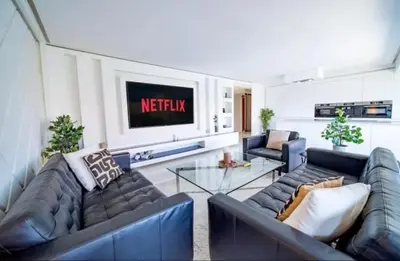 a living room with two couches and a tv at Appartement luxe hivernage in Marrakech