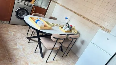 a table in a kitchen with a washing machine at 3 bedrooms 2 balconies kitchen, salon 2 bathrooms in Marrakech