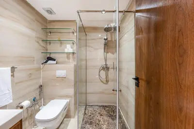 a bathroom with a shower and a toilet at Stylish Apartment with Balcony view & Free Parking in Marrakech