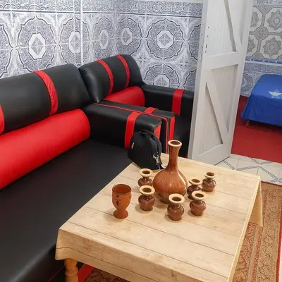 a living room with a couch and a table at Dar Saada Bab Doukkala in Marrakech