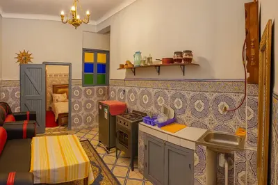 a kitchen with a stove and a counter top at Dar Saada Bab Doukkala in Marrakech