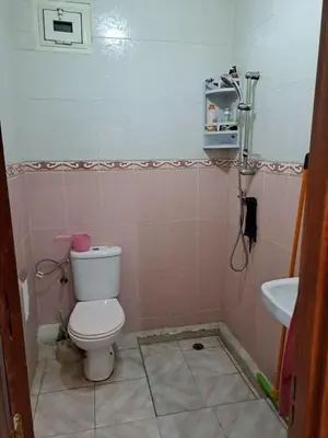 a bathroom with a toilet and a sink at Happy space in Marrakech