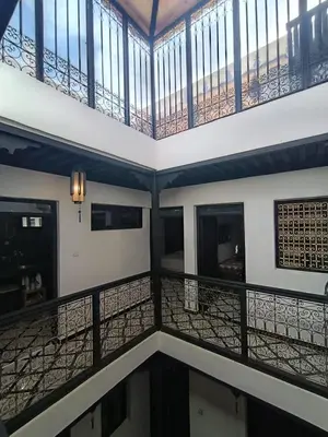 an empty room with a balcony and a ceiling at Riad Privatif 250m2 près Médina-palais Royal in Marrakech