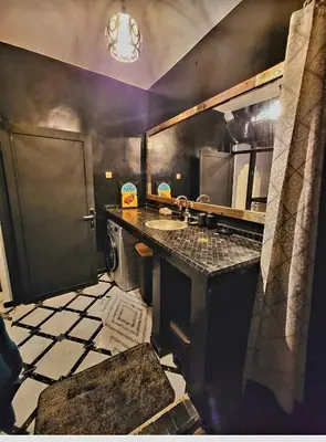a kitchen with a sink and a counter top at Riad Privatif 250m2 près Médina-palais Royal in Marrakech