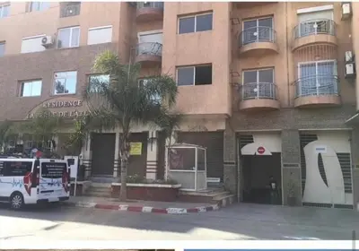 a fire truck parked in front of a building at Red city charm - city center apartment in Marrakech