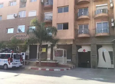 a fire truck parked in front of a building at Nice apartment in Marrakech center in Marrakech