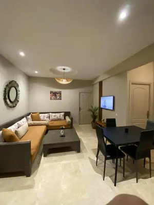 a living room with a couch and a table at Nice apartment in Marrakech center in Marrakech