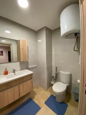 a bathroom with a toilet and a sink and a mirror at Nice apartment in Marrakech center in Marrakech