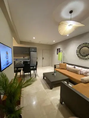 a living room with a couch and a table at Nice apartment in Marrakech center in Marrakech