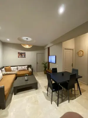 a living room with a couch and a table at Nice apartment in Marrakech center in Marrakech