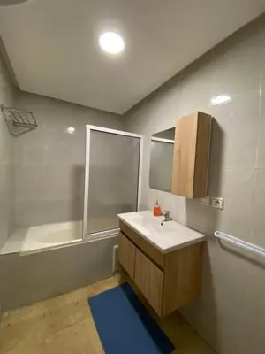 a bathroom with a sink and a bath tub at Nice apartment in Marrakech center in Marrakech
