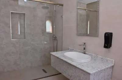 a bathroom with a sink and a shower at Villa à la palmeraie in Marrakech