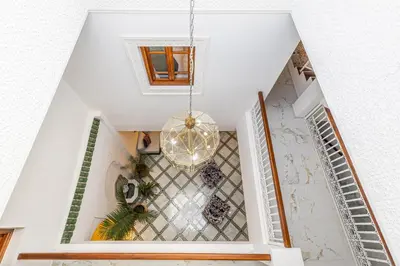 an open hallway with a chandelier in a house at Riad Mimouna - Rooftop view & Breakfast included - 4 Rooms - Fully private in Marrakech