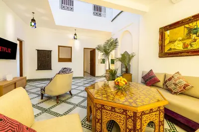 a living room with a couch and a table at Riad Mimouna - Rooftop view & Breakfast included - 4 Rooms - Fully private in Marrakech