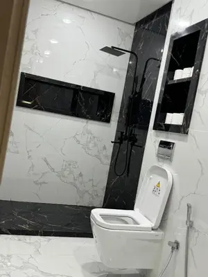 a bathroom with a white toilet and a shower at Marrakech MAROCCO in Marrakech