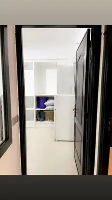 an open door to an empty refrigerator in a room at Spacious 2BR with Parking & Local Life & Centra in Marrakech