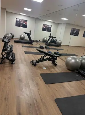 a gym with many pilates equipment in a room at Beautiful Apartment in Guéliz Pools & Jacuzzi in Marrakech