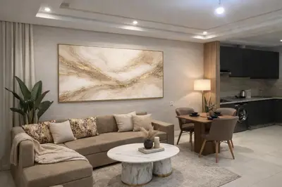 a living room with a couch and a table at Appartement coup de coeur in Marrakech