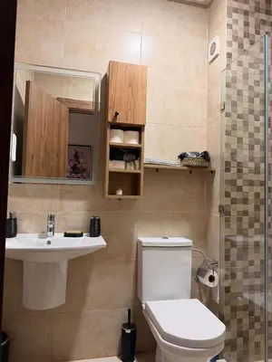 a small bathroom with a toilet and a sink at Appart Cosy et confort en plein centre Marrakech in Marrakech