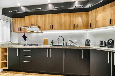 a kitchen with a sink and a counter top at Downtown Cozy Apartment with Panoramic View in Marrakech