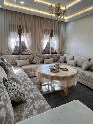 a living room with a couch and a table at cozy and spacious apartment in Marrakech