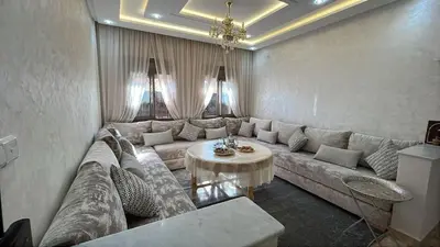 a living room with a couch and a table at cozy and spacious apartment in Marrakech