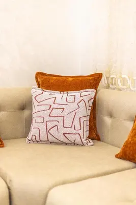 a pillow sitting on top of a couch at Luxurious and Cozy Apartment with Parking and View in Marrakech