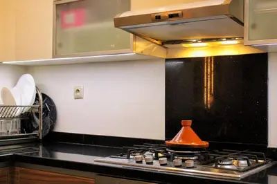 a kitchen with a stove top oven in a kitchen at apparemment 35 in Marrakech