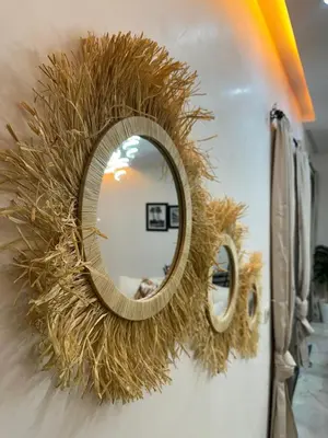 a wreath on a door with a mirror on it at Appartement plaza in Marrakech