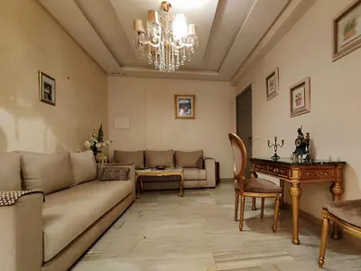a living room with a couch and a table at Nilia in Marrakech