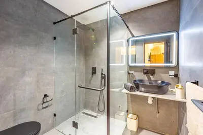 a bathroom with a shower and a sink at Le Nid de Guéliz Private terrace and silence in Marrakech