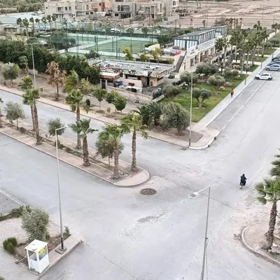 an aerial view of a street with palm trees at Cozy flat near airport in Marrakech