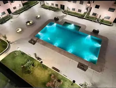 an overhead view of a swimming pool in a building at Jnane El Ali 3 in Marrakech