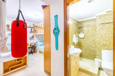 a bathroom with a punching bag hanging from the wall at Oasis Familiale Marrakech Piscine & Résidence Sécurisée in Marrakech