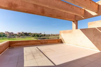 a balcony with a view of a golf course at Private Pool Villa Facing Golf Luxury inMarrakech in Marrakech