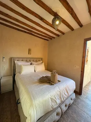 a bedroom with a large bed in a room at Duplex Bahia Palace in Marrakech