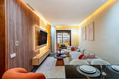 a living room with a couch and a tv at Gueliz Signature Terrasse and Comfort in Marrakech