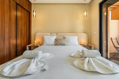 a bedroom with a large white bed with two pillows at Gueliz Signature Terrasse and Comfort in Marrakech