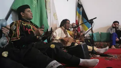 a group of men sitting in a room playing music at Proworkshop in Marrakech