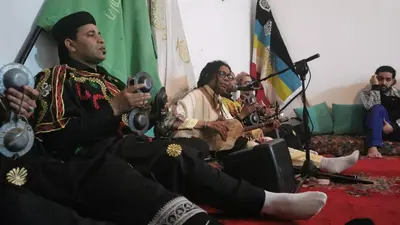 a group of men singing and playing instruments at Proworkshop in Marrakech
