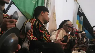 a group of men sitting in a room with microphones at Proworkshop in Marrakech