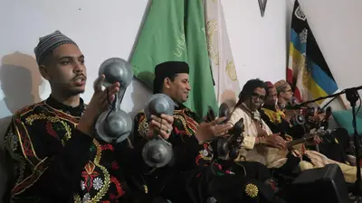 a group of men in traditional clothing holding balls at Proworkshop in Marrakech