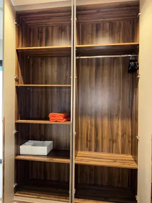 a closet with wooden walls and wooden shelves at Refined apartment with rooftop pool in Marrakech